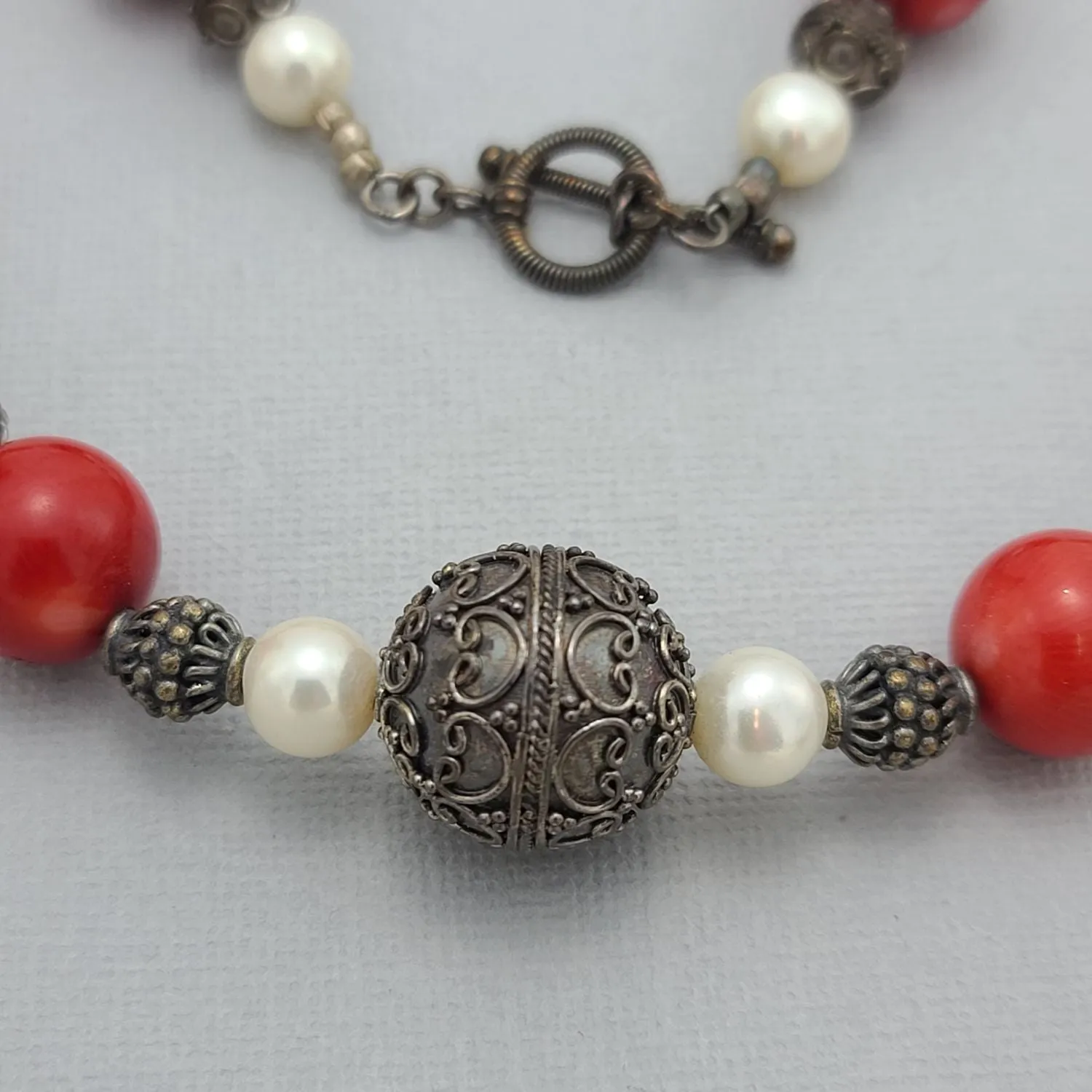 Handmade Red Coral and Pearl Beaded Necklace with Silver Accents.