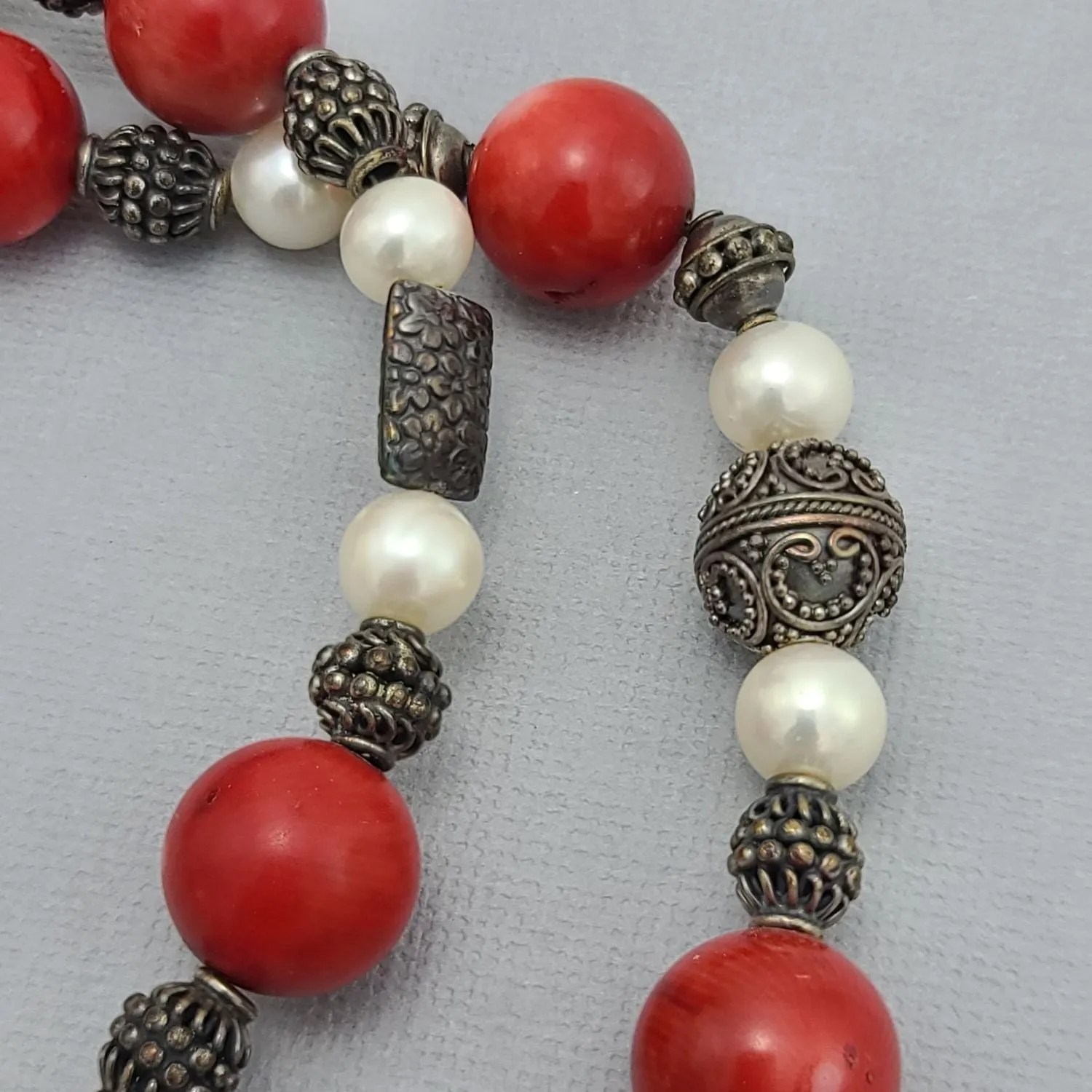 Handmade Red Coral and Pearl Beaded Necklace with Silver Accents.