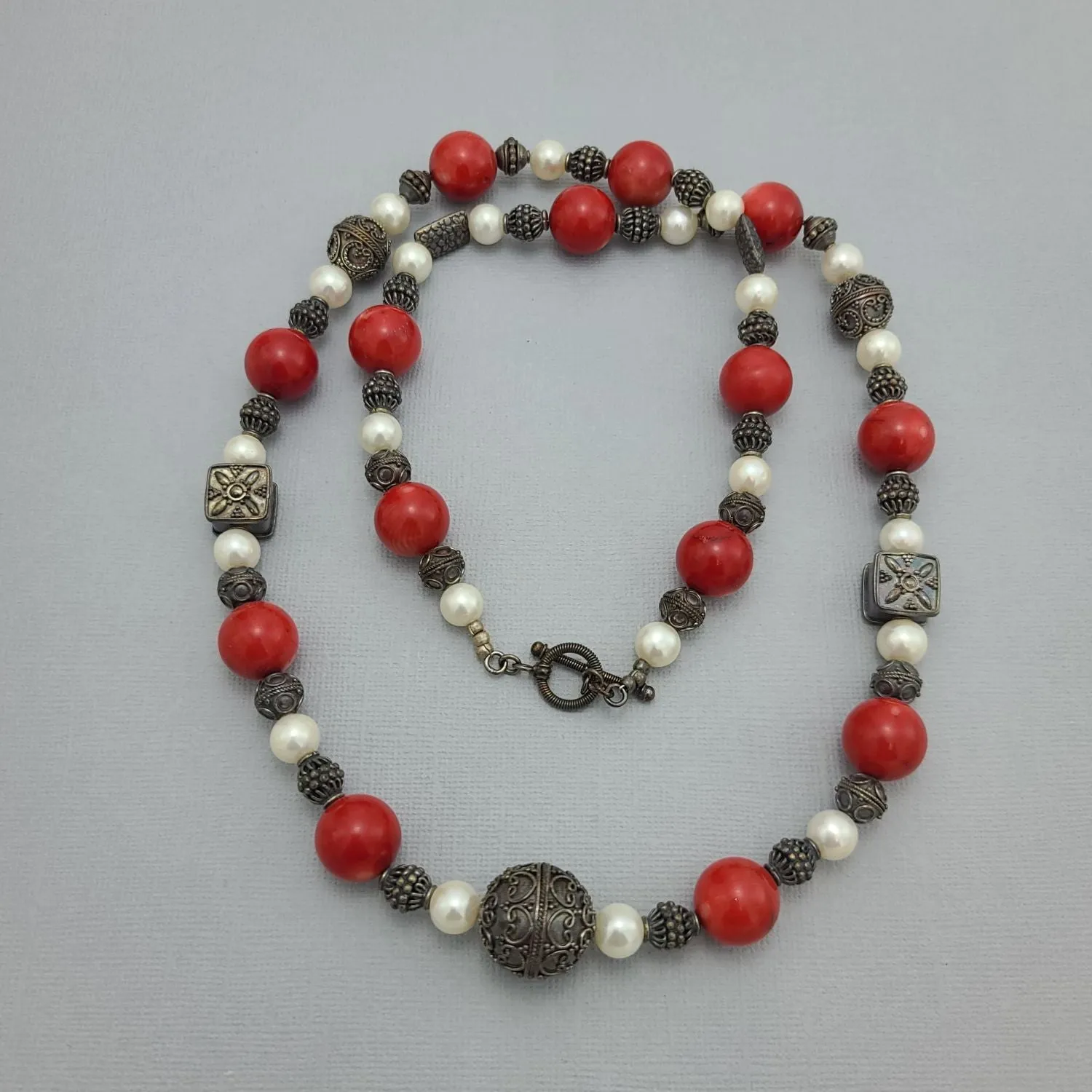 Handmade Red Coral and Pearl Beaded Necklace with Silver Accents.