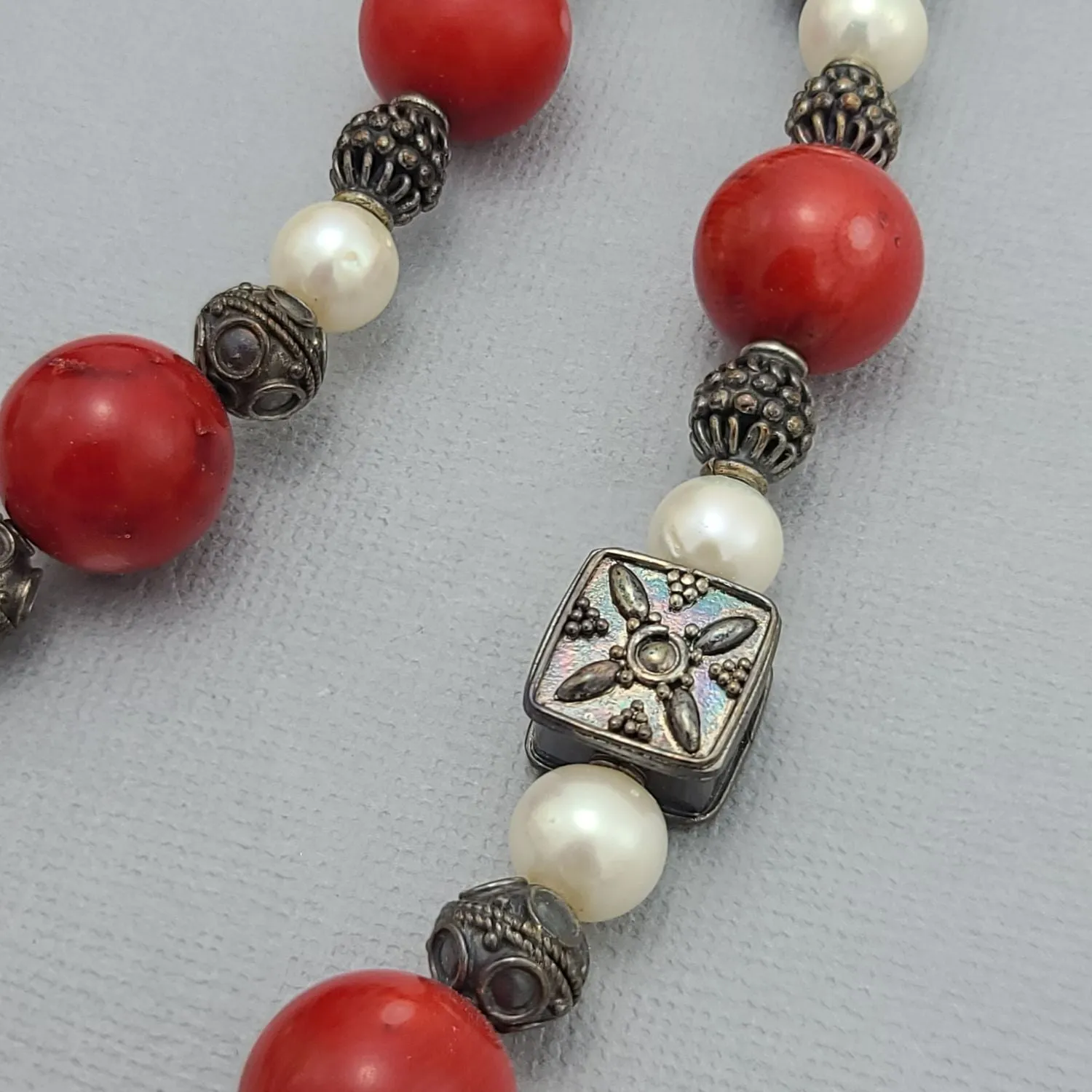 Handmade Red Coral and Pearl Beaded Necklace with Silver Accents.