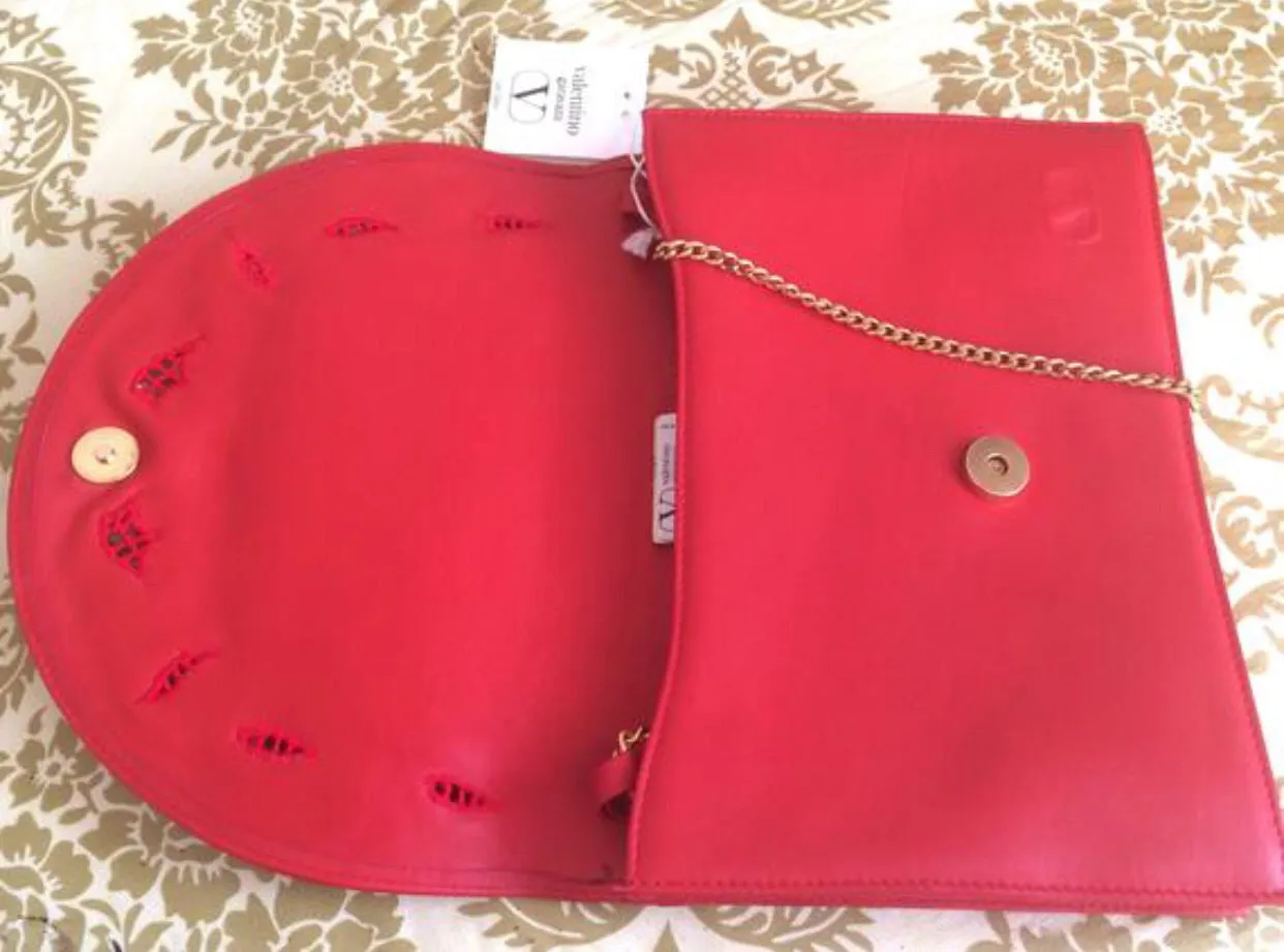 Vintage Valentino Garavani red leather clutch shoulder bag with red flower embroidery deco on the flap and V logo.