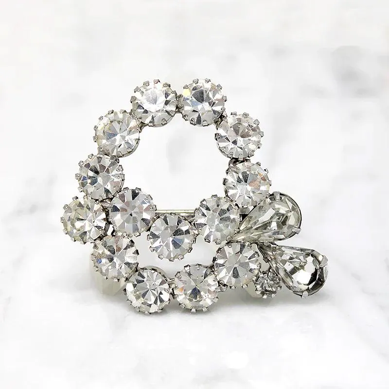 Vivacious White Rhinestone Swirl Brooch