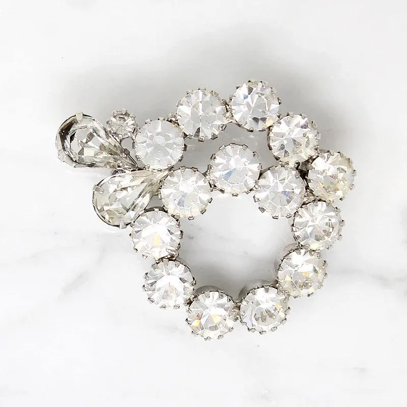 Vivacious White Rhinestone Swirl Brooch