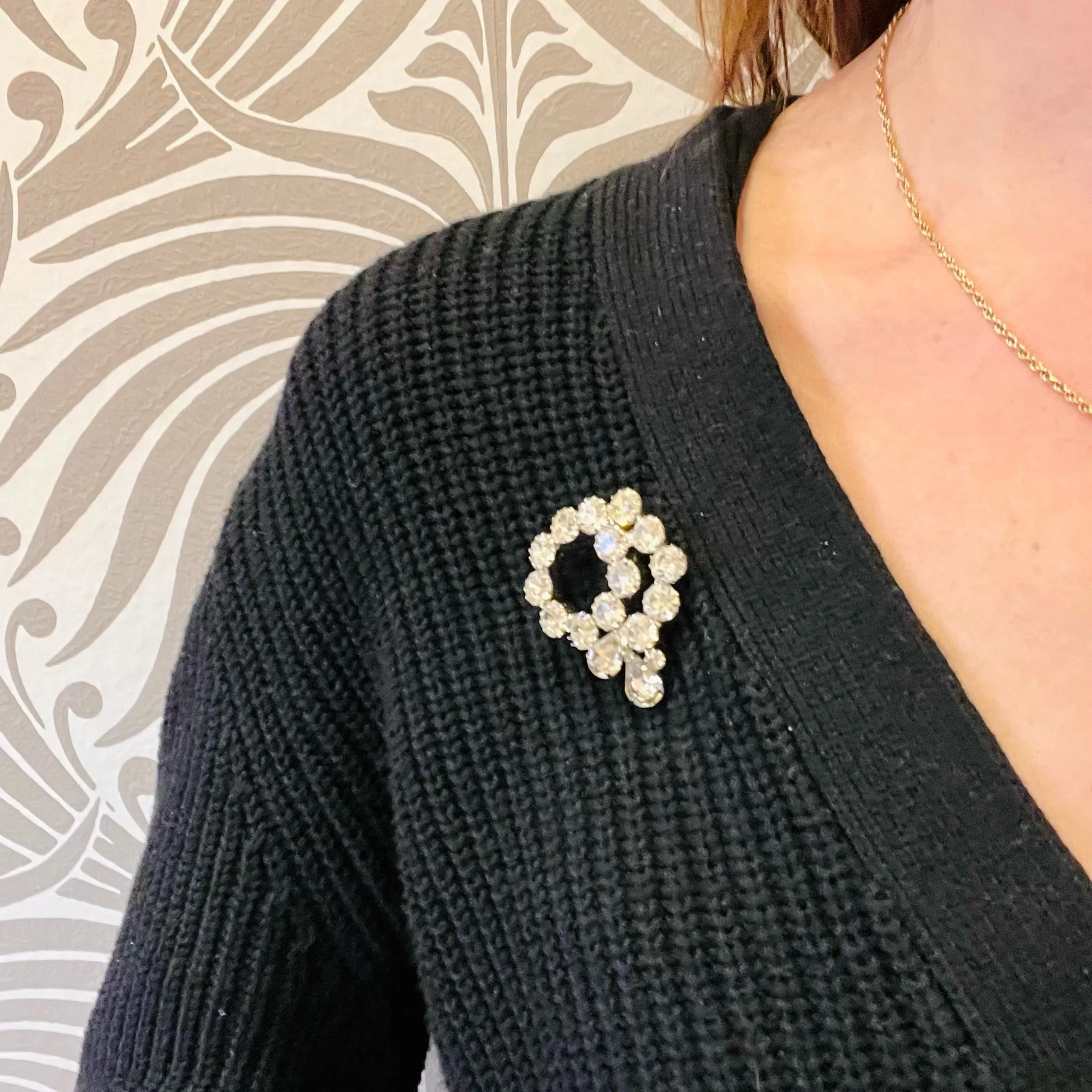 Vivacious White Rhinestone Swirl Brooch