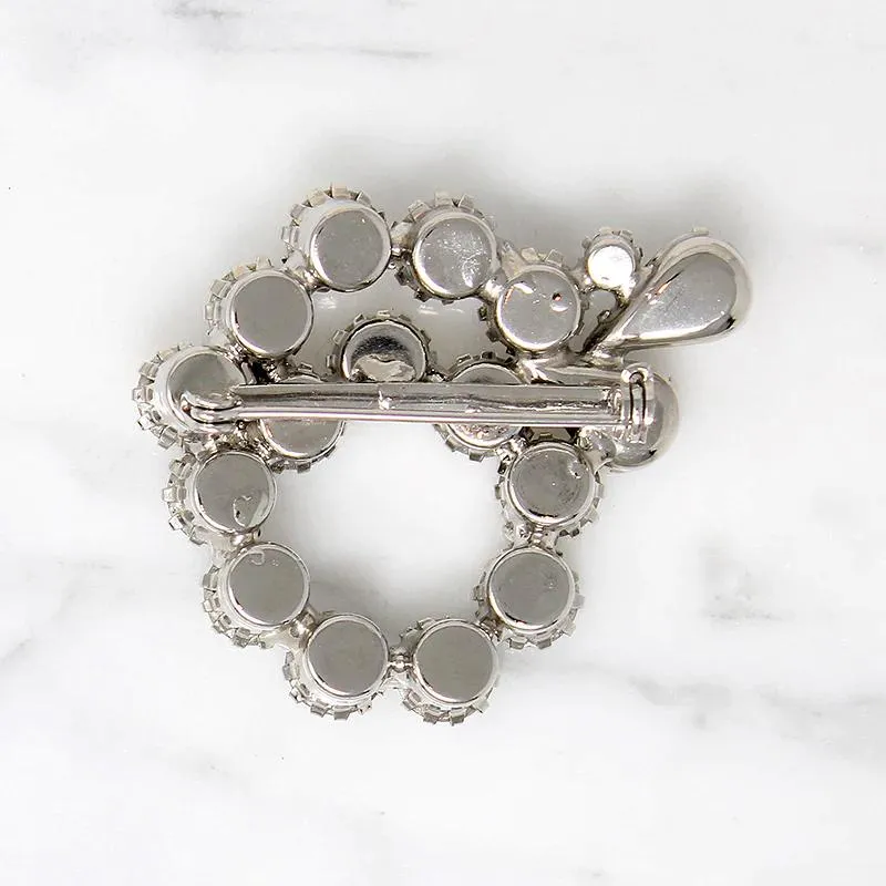 Vivacious White Rhinestone Swirl Brooch